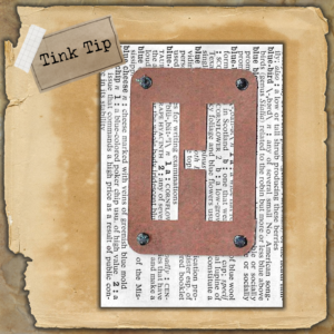 The Final Result - Glitter Glue over the Black Sharpie used to fill small holes in stencil letter for junk journal embellishment